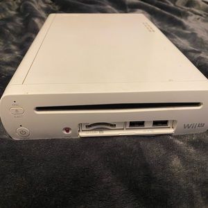 Wii U + Wii ucontroller with all cords and 5 games